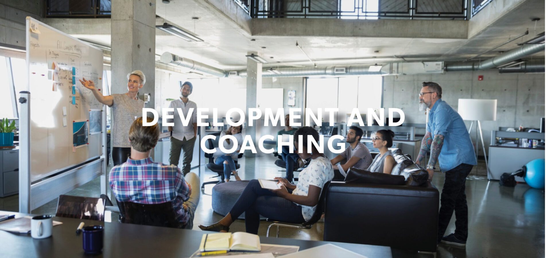 Development Coaching Banner with people in the background