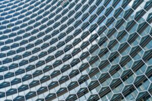 Modern hexagon-patterned building facade symbolizing team structure, alignment, and collaboration