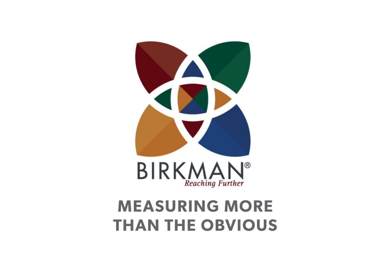 Birkman Method logo showing four-color petals with tagline Reaching Further