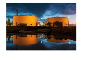 Industrial storage tanks at a global terminal at dusk